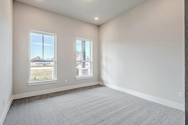 spare room featuring carpet floors