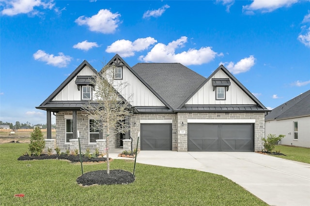 view of front of home with a garage and a front yard