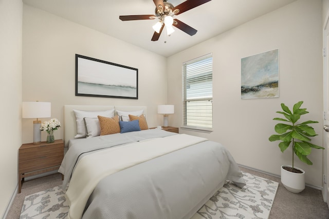 carpeted bedroom with ceiling fan