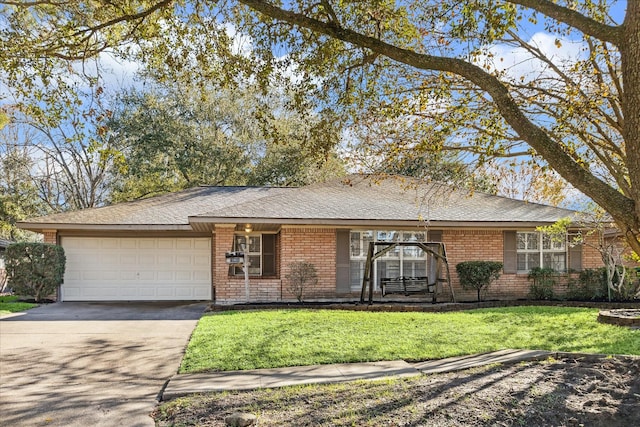 ranch-style home with a front lawn and a garage