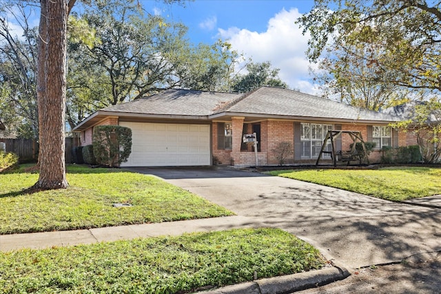 ranch-style home with a garage and a front lawn