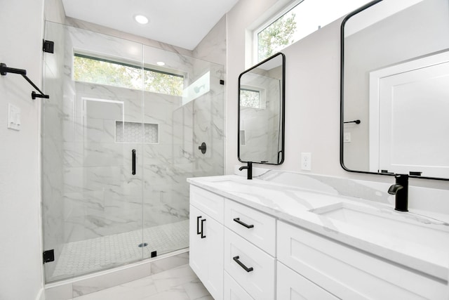 bathroom featuring vanity and an enclosed shower