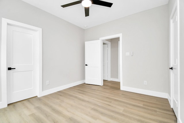 unfurnished bedroom with ceiling fan and light hardwood / wood-style floors