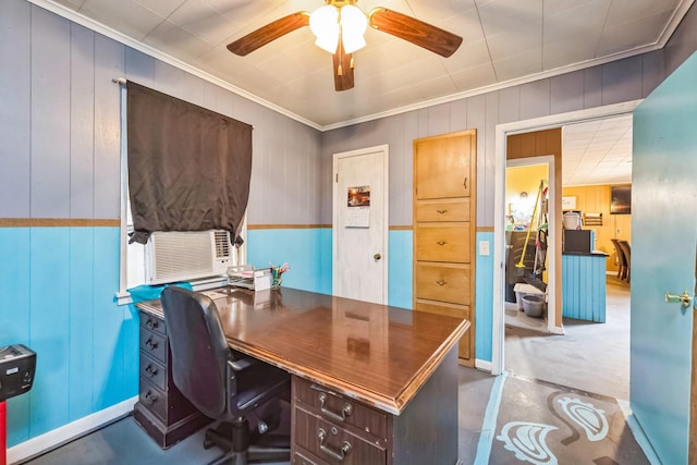 office area with concrete flooring, crown molding, wooden walls, and ceiling fan