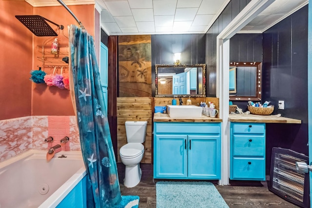 full bathroom with hardwood / wood-style floors, shower / bath combo with shower curtain, vanity, toilet, and wood walls