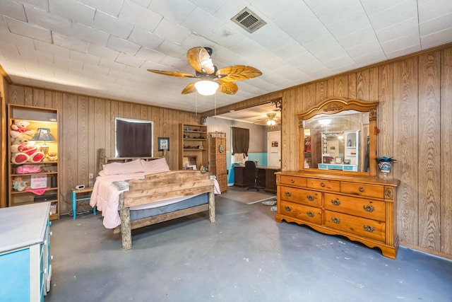 bedroom featuring ceiling fan and wood walls