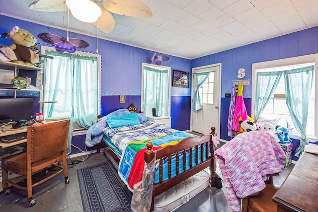 bedroom with concrete flooring and ceiling fan