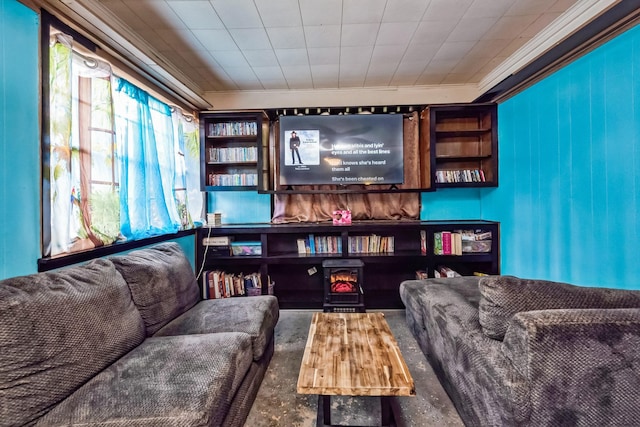 living area featuring crown molding