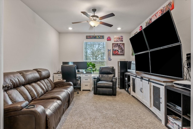 living room with ceiling fan and light colored carpet