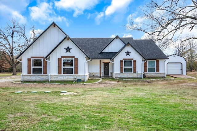 modern farmhouse style home featuring a front yard and a garage