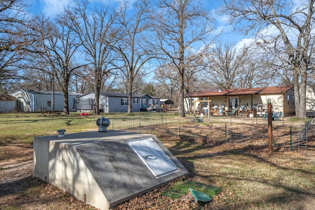 view of storm shelter with a yard