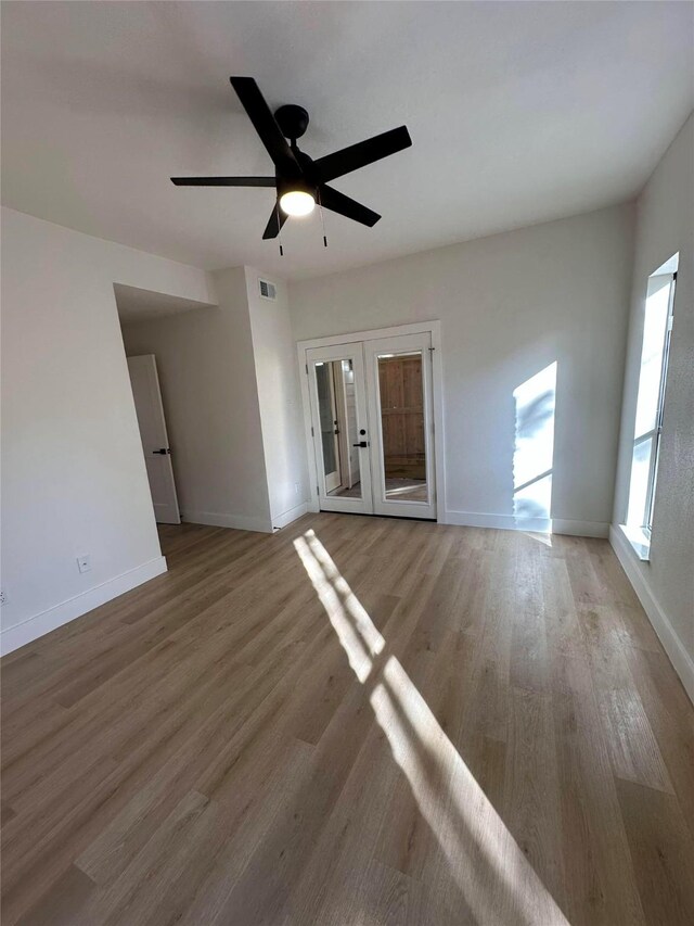 spare room featuring ceiling fan and hardwood / wood-style flooring