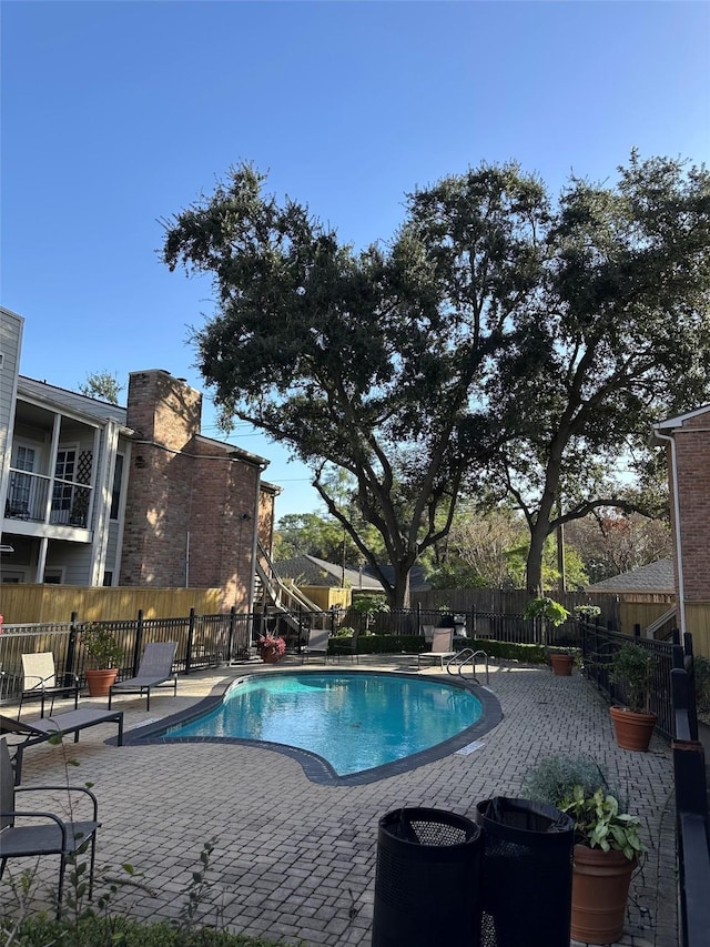 view of pool featuring a patio