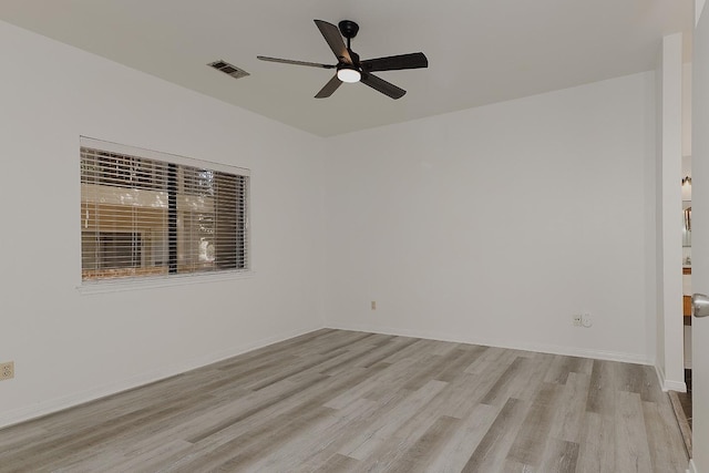 empty room featuring ceiling fan and light hardwood / wood-style flooring