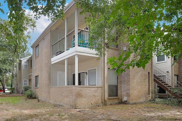 view of property exterior featuring a balcony