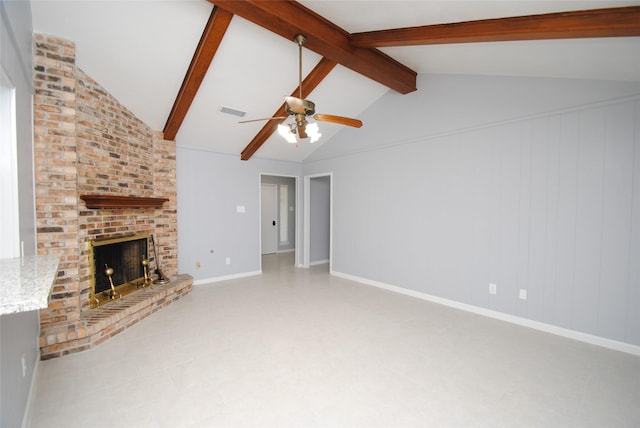 unfurnished living room with ceiling fan, a brick fireplace, and vaulted ceiling with beams