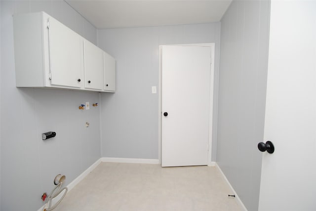 laundry room with washer hookup and cabinets