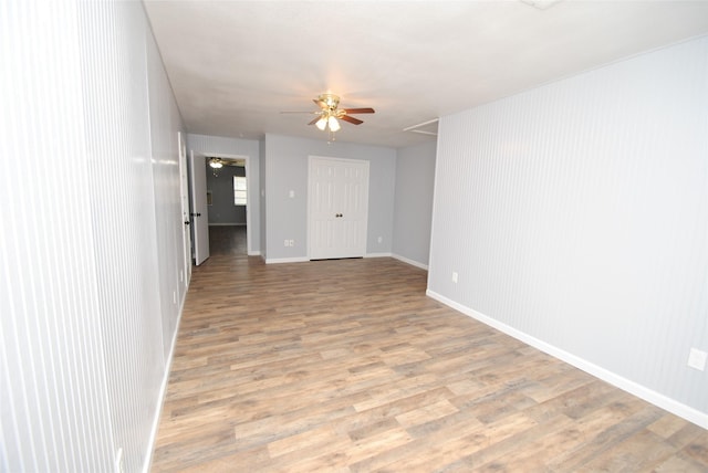 unfurnished room with light hardwood / wood-style floors and ceiling fan