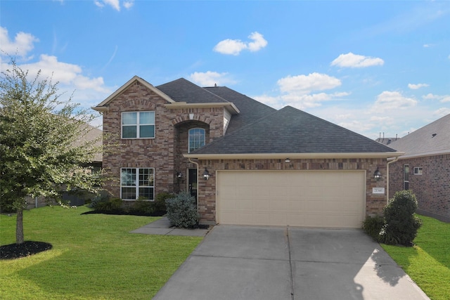 view of property with a front lawn and a garage