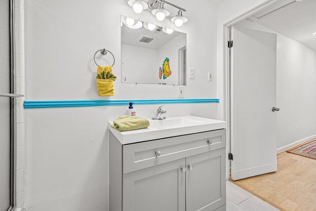 bathroom featuring vanity and wood-type flooring