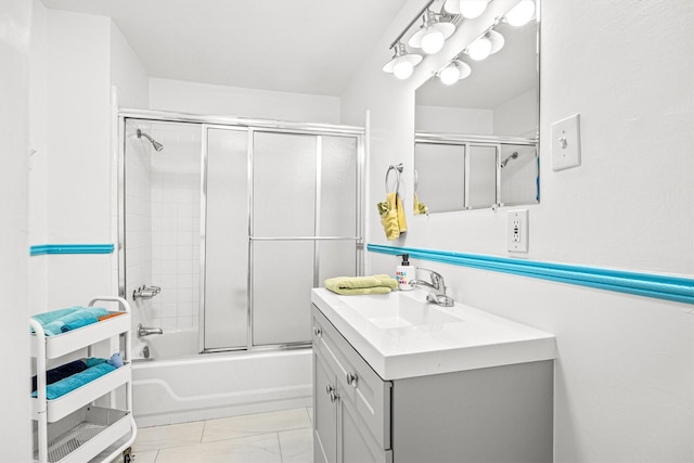 bathroom with combined bath / shower with glass door and vanity