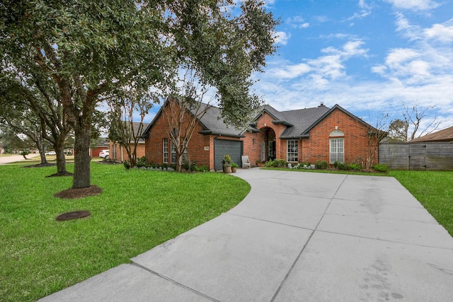 single story home featuring a front lawn and a garage