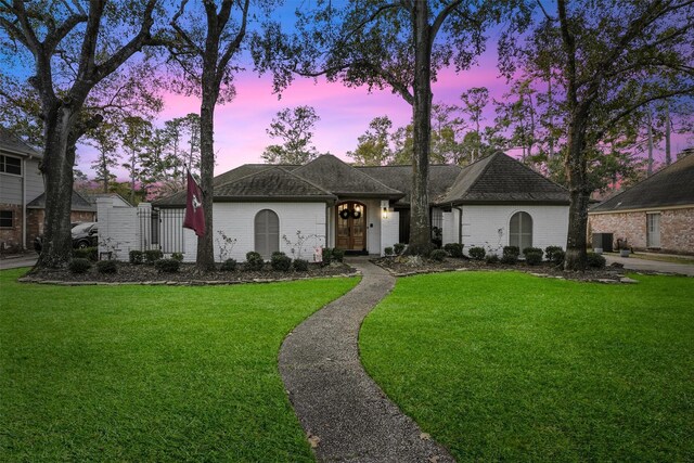 ranch-style house featuring a yard