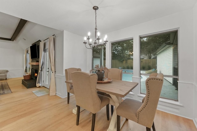 dining area featuring an inviting chandelier and light wood-type flooring