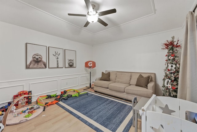 living room with hardwood / wood-style flooring and ceiling fan