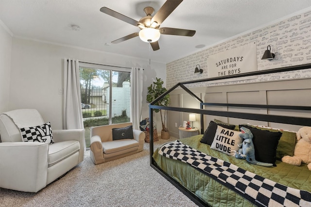 carpeted bedroom with crown molding and ceiling fan