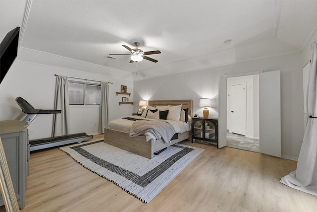 bedroom with ceiling fan and light hardwood / wood-style flooring