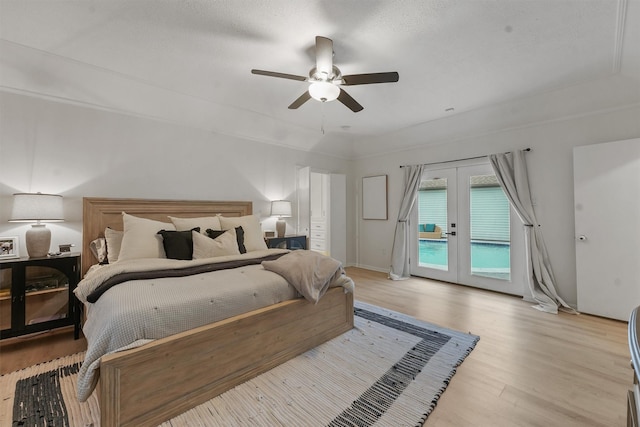 bedroom featuring french doors, ceiling fan, light hardwood / wood-style floors, and access to outside