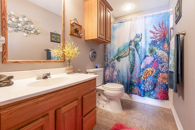 bathroom with toilet and vanity