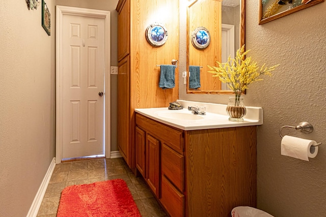 bathroom with tile patterned floors and vanity