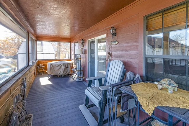 sunroom featuring wood ceiling