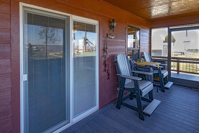 sunroom / solarium with a wealth of natural light and wood ceiling