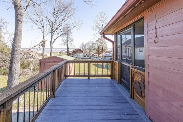 wooden terrace with a shed