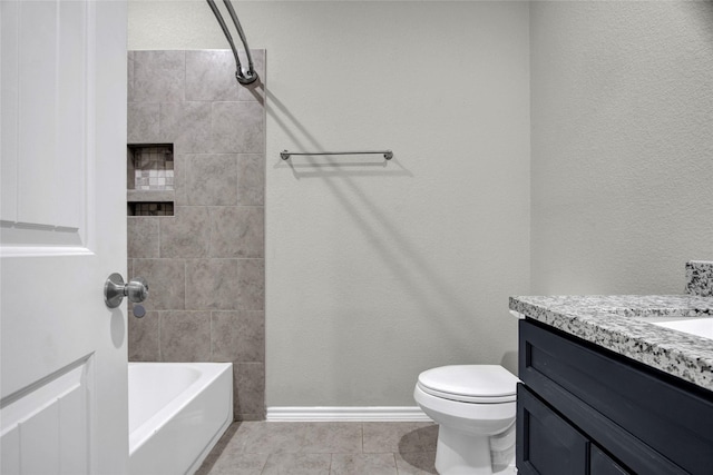 full bathroom featuring tile patterned floors, toilet, vanity, and tiled shower / bath