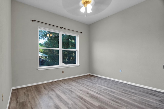 unfurnished room featuring ceiling fan and light hardwood / wood-style floors