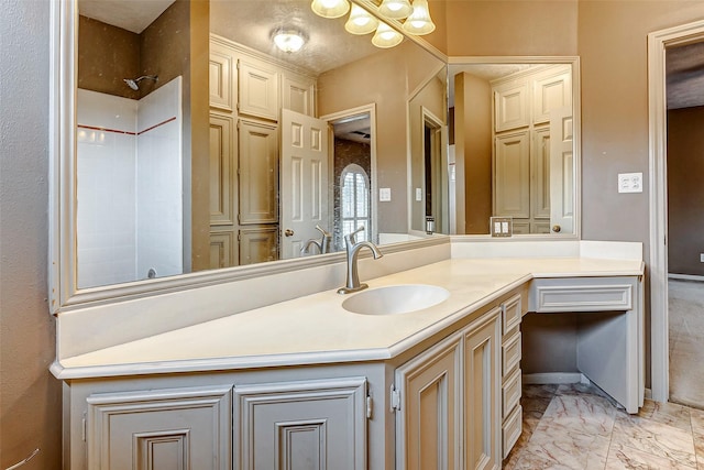 full bathroom with a shower, marble finish floor, and vanity