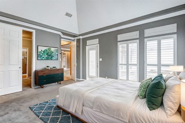 bedroom with carpet floors, a high ceiling, and visible vents