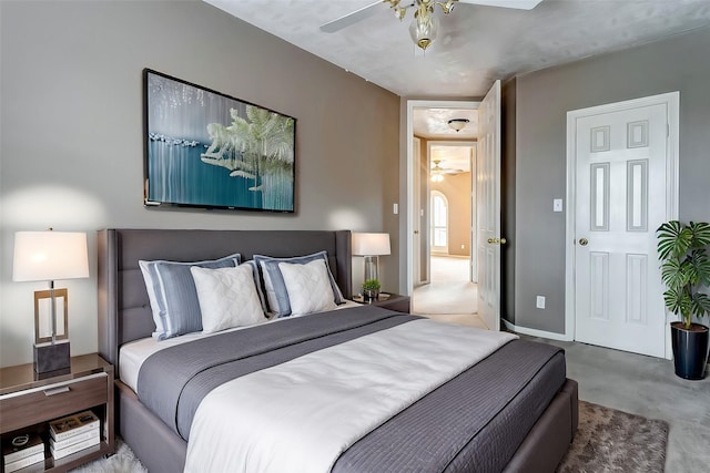 bedroom featuring a ceiling fan and baseboards