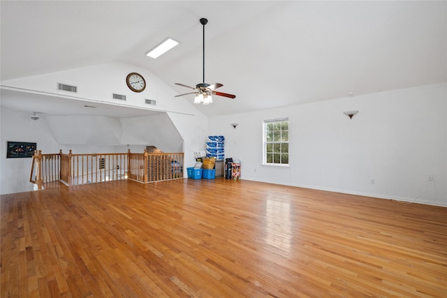 unfurnished living room with light hardwood / wood-style floors, lofted ceiling, and ceiling fan