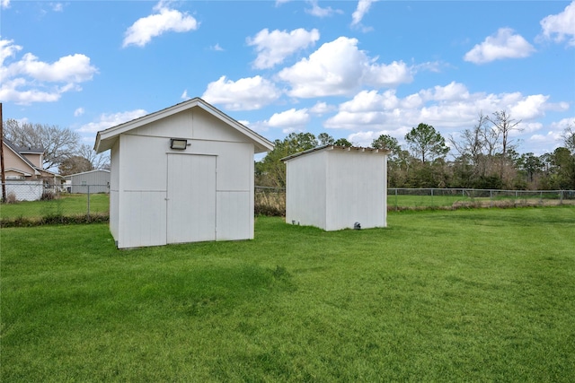 view of outdoor structure featuring a lawn