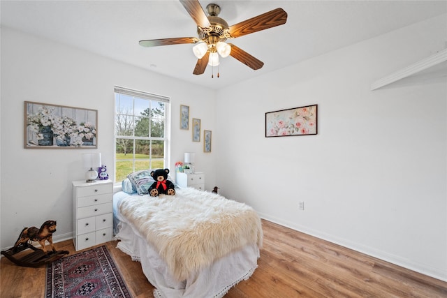 bedroom featuring ceiling fan and light wood-type flooring