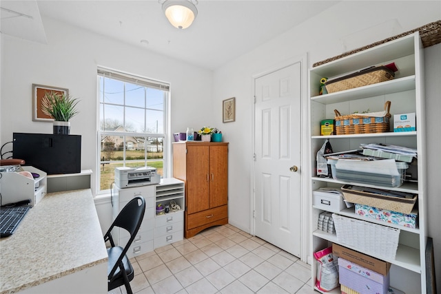 office space with a healthy amount of sunlight and light tile patterned floors