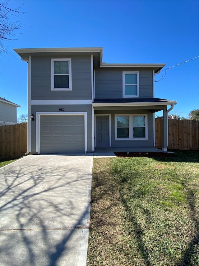 front of property with a garage, a front yard, and a porch