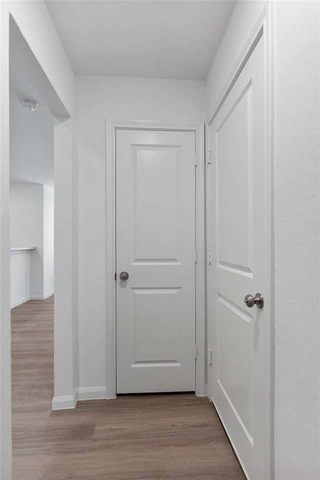 hallway with light wood-type flooring