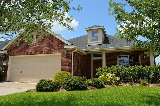 view of front facade with a garage and a front lawn