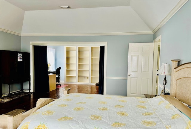 bedroom with ornamental molding, vaulted ceiling, and wood-type flooring